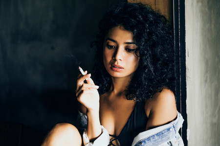 Girl with cigarette in a cafe