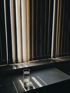 Window blinds with light shining