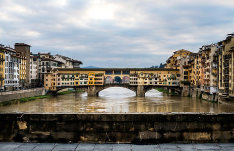 Perspective view of Old Ponte Vecchio Bridge on dull day  Florence  Italy