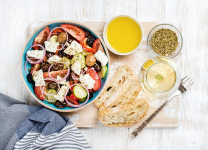 Greek salad with olive oil bread spices and white wine