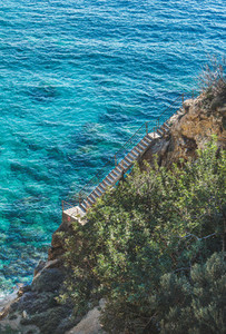 Stairs leading down to lagoon and turquoise sea waters  Turkey