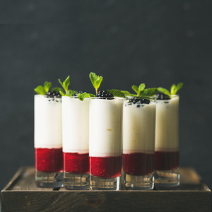 Dessert in glass with blackberries and mint  square crop