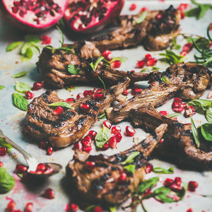 Grilled lamb ribs with pomegranate seeds  mint and rosemary