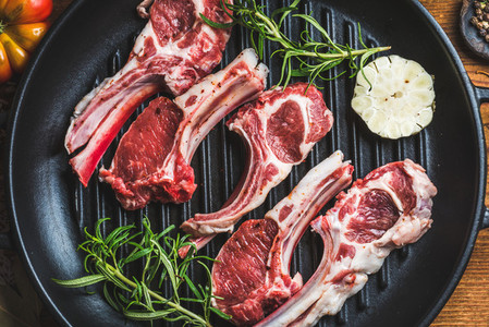 Raw uncooked lamb meat chops with rosemary and garlic