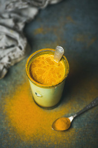 Golden milk with turmeric powder  clean eating detox concept