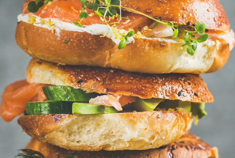 Close-up of Bagels with salmon, eggs, vegetables, capers, cream-cheese, herbs