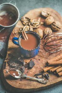 Making rich hot chocolate with cinnamon and walnuts