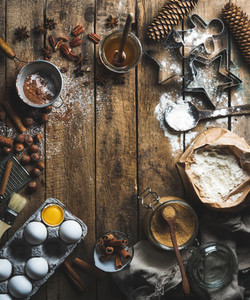 Christmas holiday cooking and baking ingredients on wooden background