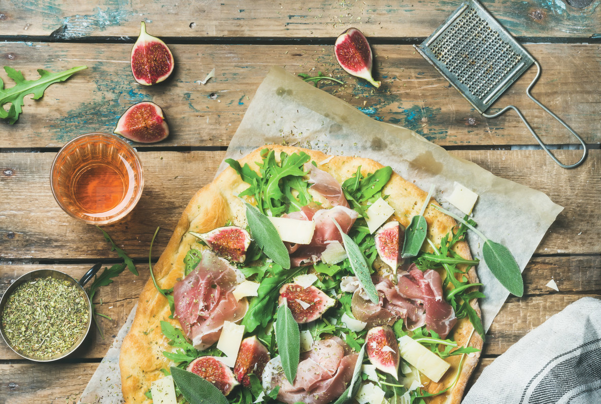 Fig, prosciutto, arugula, sage flatbread pizza and rose wine