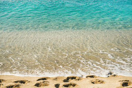 Clear water and footprints at Cleopatra beach Alanya Turkey