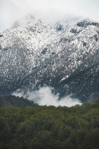 Green slopes of the Taurus mountains covered with snow