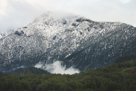 Green slopes of the Taurus mountains covered with snow