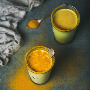 Golden milk with turmeric powder  dieting and weight loss concept