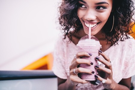 Woman drinking a fresh smoothie