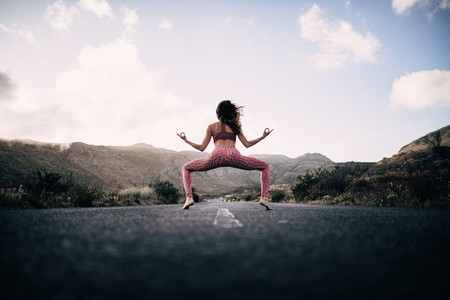 Yoga Girl Meditating on road