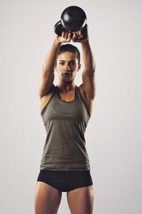Woman working out with kettle bell