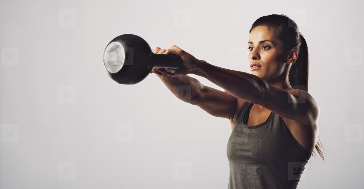 Woman exercise with kettle bell   Crossfit workout