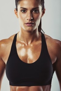 Attractive female bodybuilder posing confidently