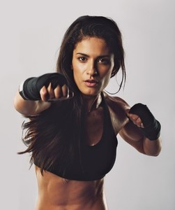 Hispanic female practicing boxing