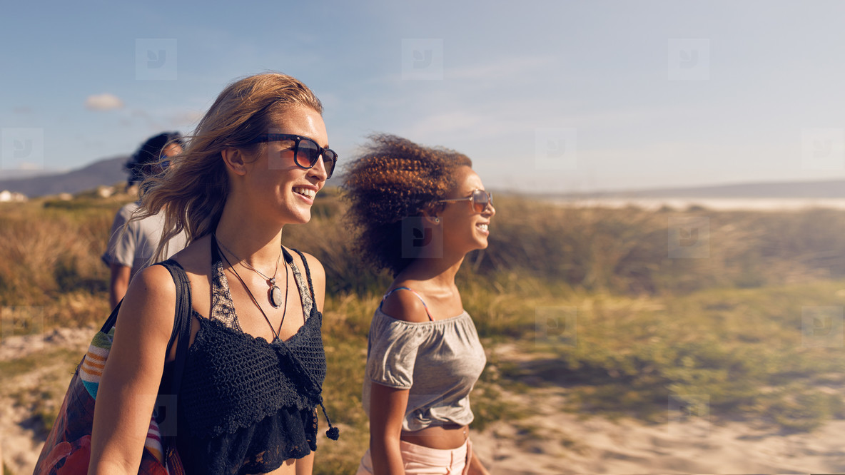 Young women going on the beach