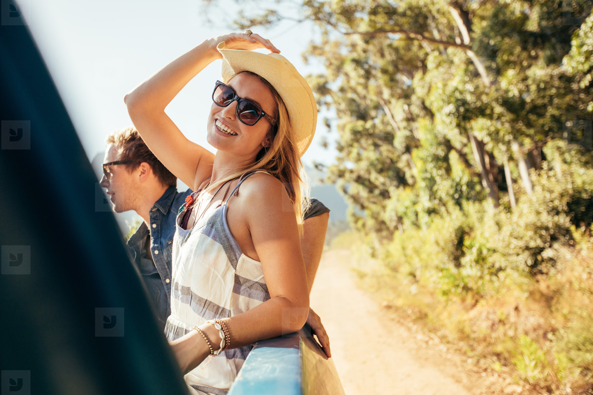 Attractive woman in the back of truck with friends