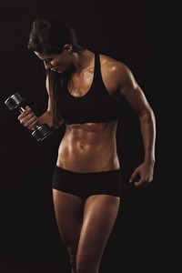 Fitness woman lifting hand weight