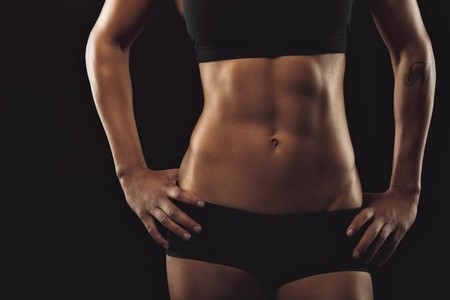 Female with perfect abdomen muscles
