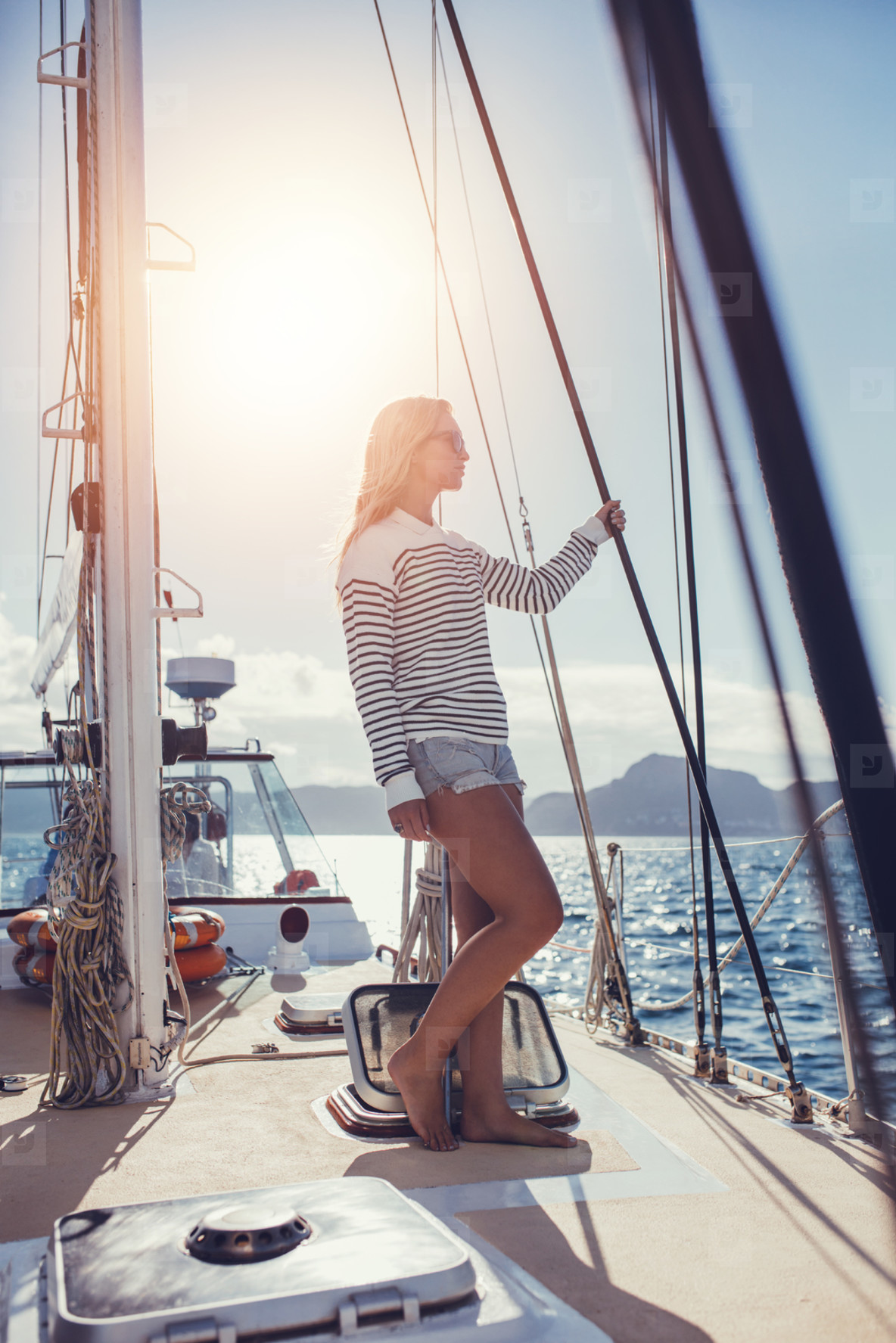 Woman standing on deck of boat