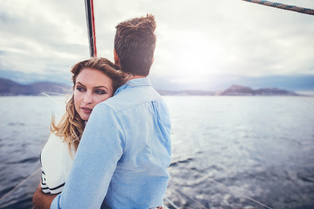 Loving young couple on a boat trip