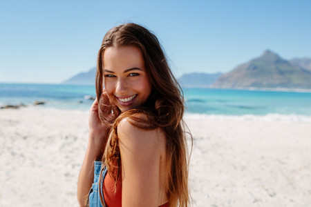 Beautiful female model posing on the sea shore