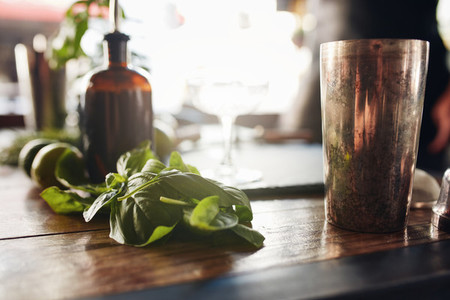 Basil leaves with cocktail shaker