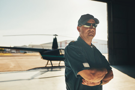 Confident helicopter pilot in uniform