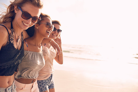 Group of young women enjoying vacation on beach