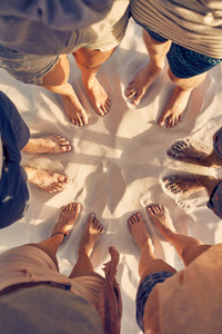 Feet of young people standing in a circle
