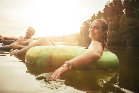 Young couple relaxing in water on a summer day