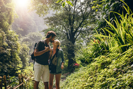 Couple in love kissing while hiking