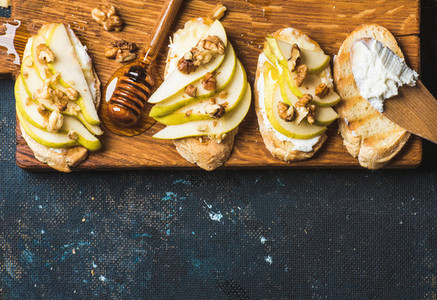Crostini with pear ricotta cheese honey and walnuts