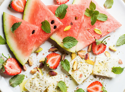Summer watermelon  strawberry and feta cheese salad with pistachios