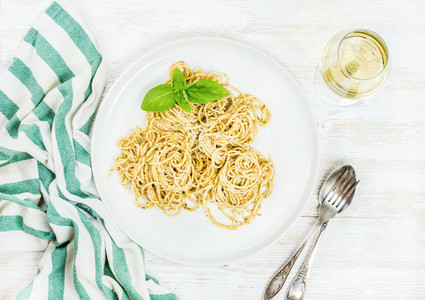 Pasta spaghetti with pesto sauce fresh basil and white wine