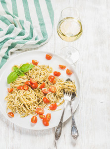 Pasta spaghetti with pesto sauce cherry tomatoes white wine