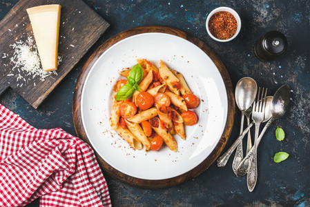 Pasta penne with tomato sauce basil and roasted tomatoes