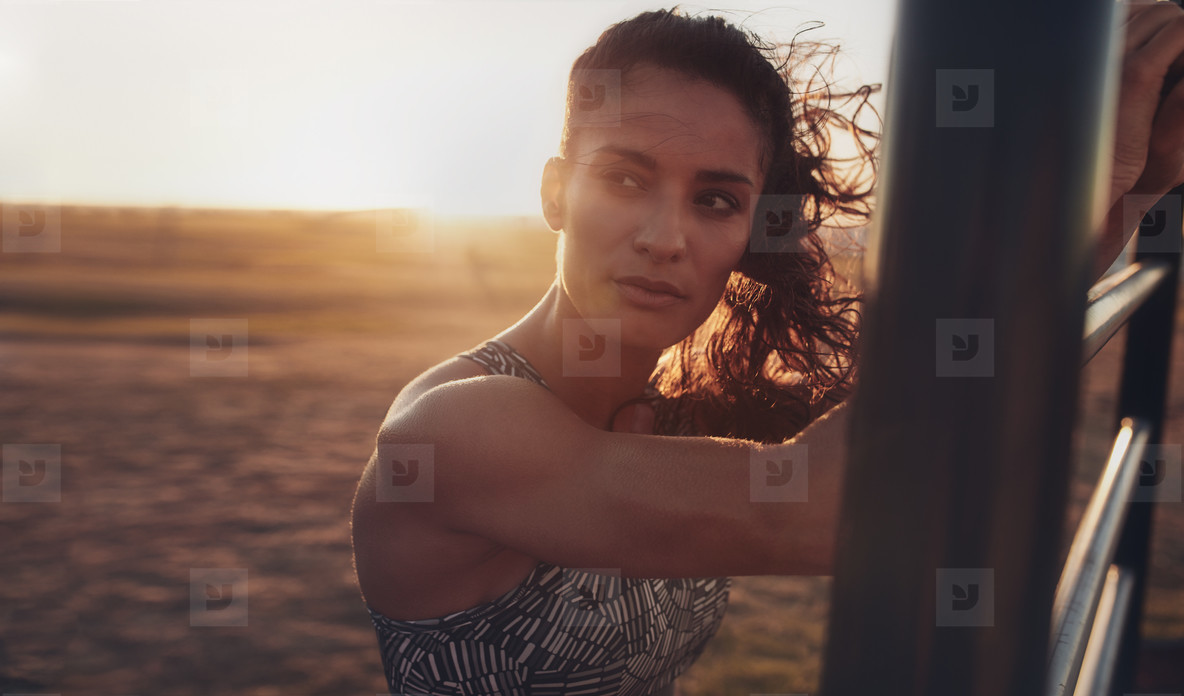 Fitness woman working out at exercise area on the beach