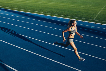 Female sprinter training for race competition