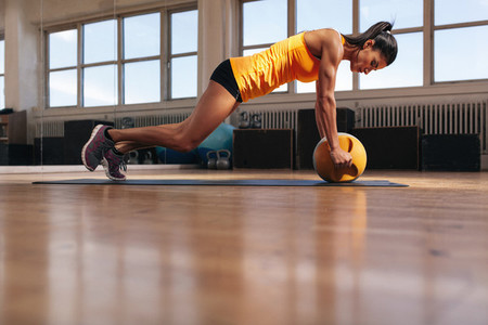 Female athlete working out on her core muscle