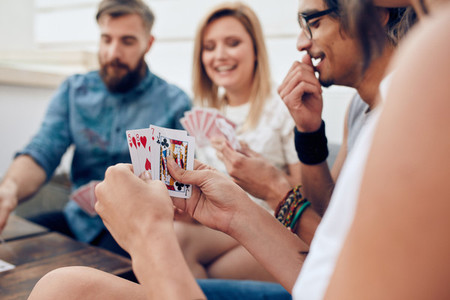 Group of friends playing card