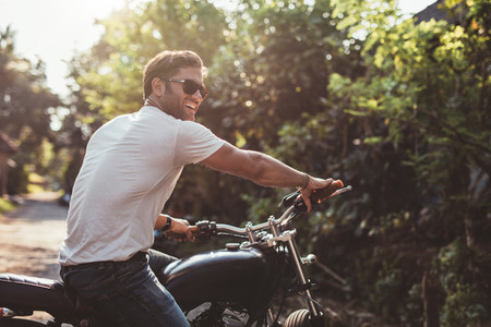 Handsome young man on motorcycle
