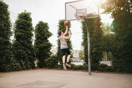 Teenage guy playing streetball