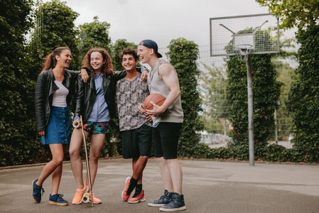 Multiracial group of people on basketball court