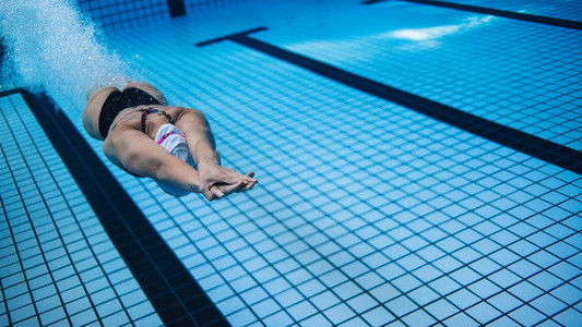 Woman training in swimming pool