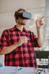 Developer using virtual reality simulator headset
